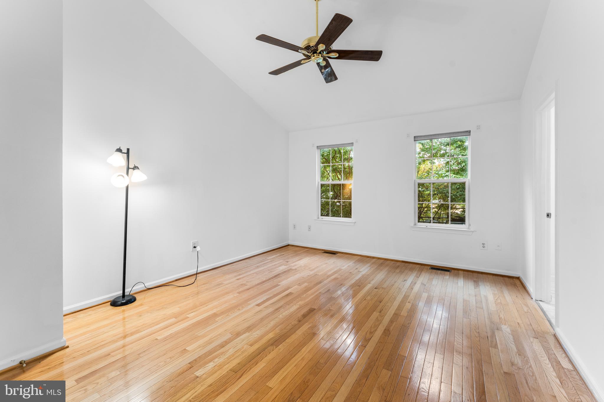9443 Fields Road Gaithersburg, MD 20878 - Photo 20 of 27 a view of empty room with wooden floor and fan