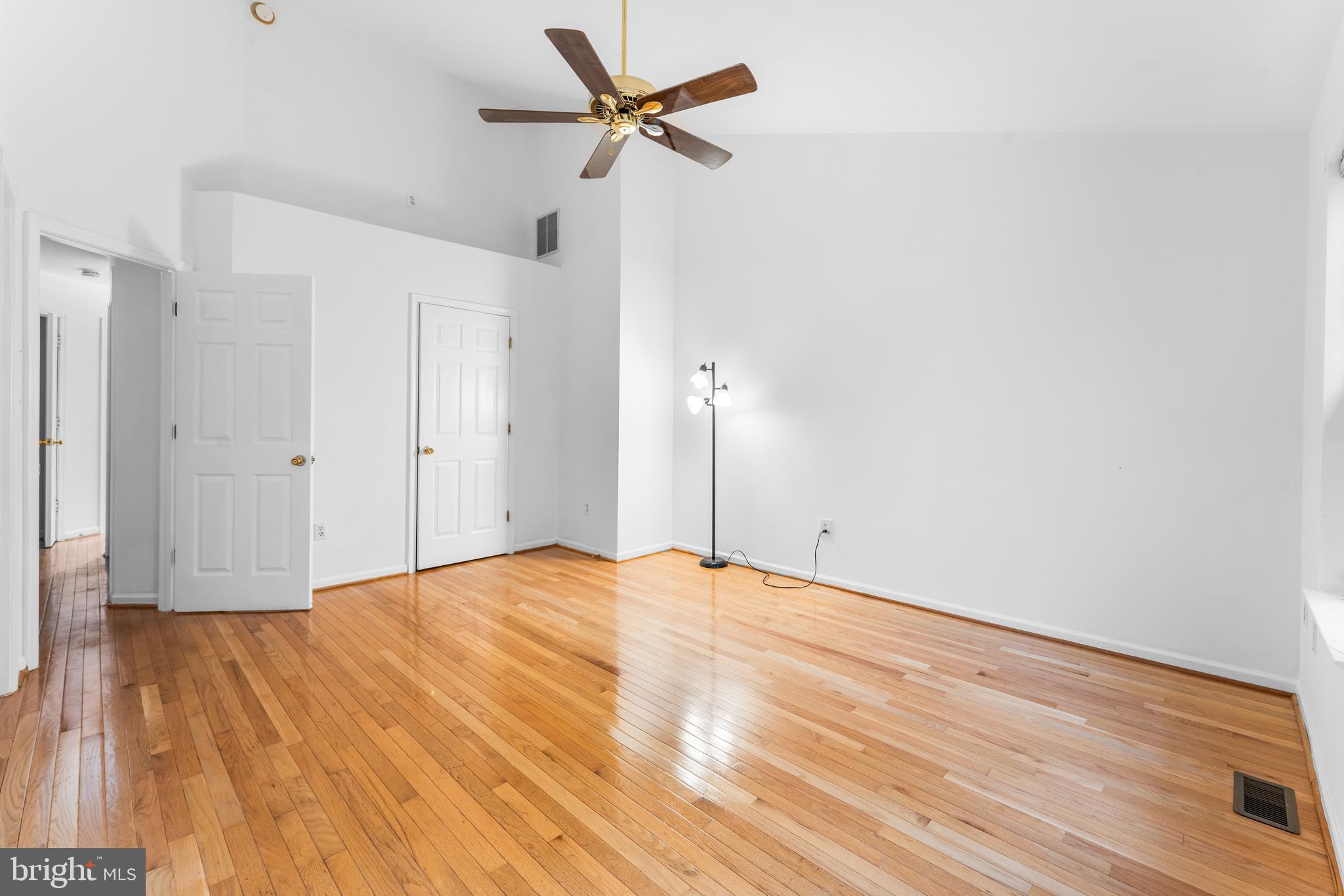 9443 Fields Road Gaithersburg, MD 20878 - Photo 21 of 27 a view of empty room with wooden floor