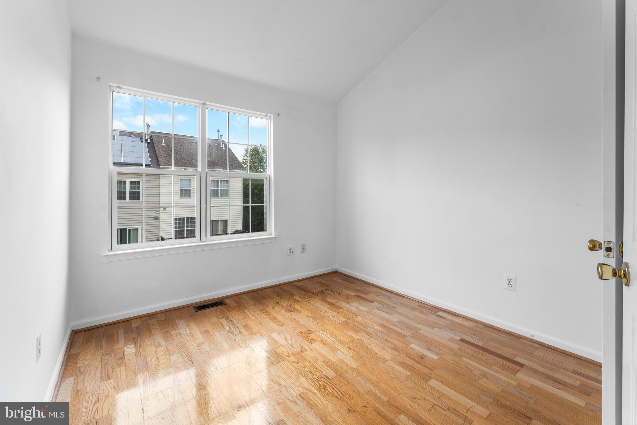 9443 Fields Road Gaithersburg, MD 20878 - Photo 25 of 27 a view of an empty room with a window