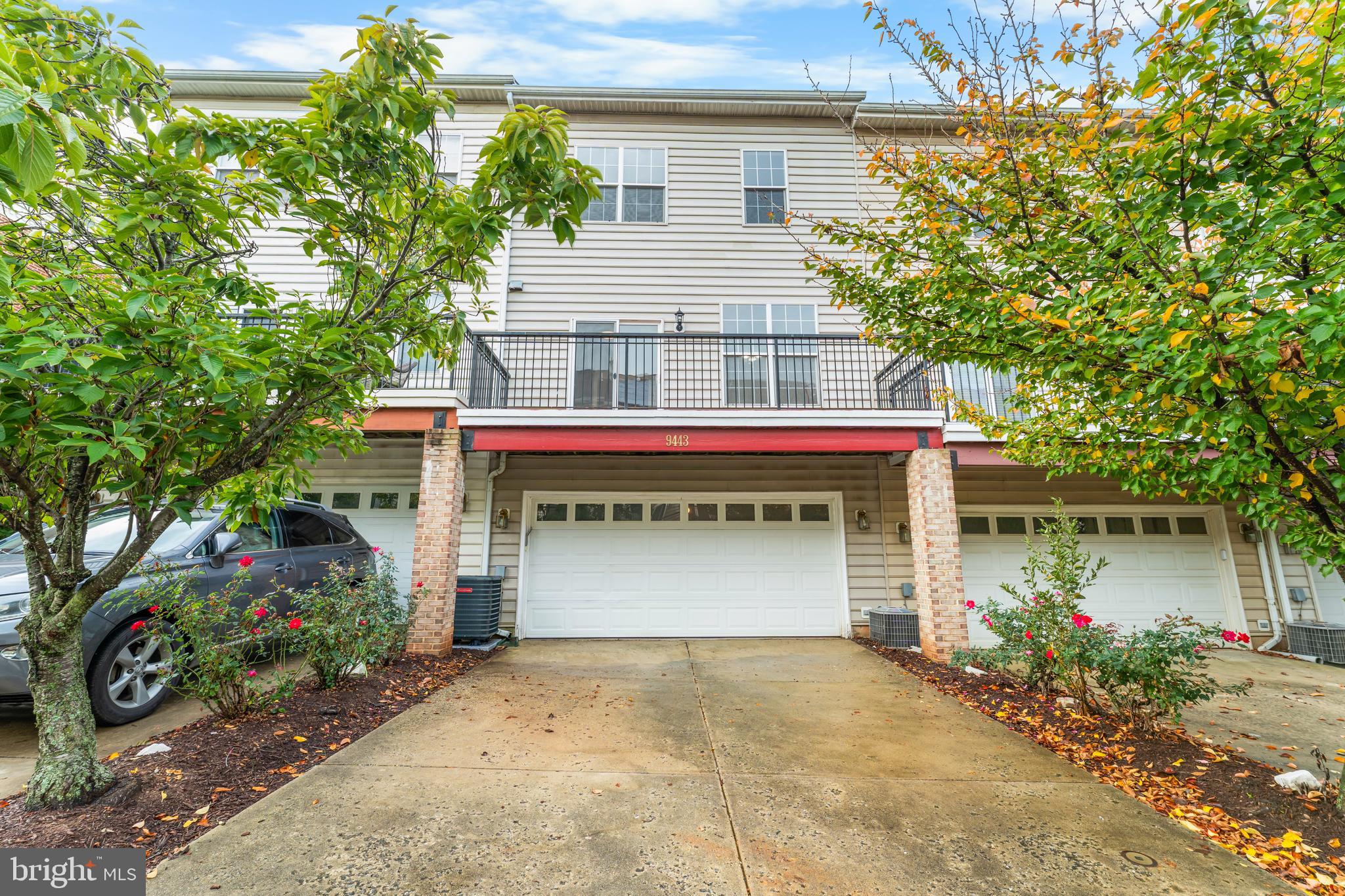 9443 Fields Road Gaithersburg, MD 20878 - Photo 26 of 27 a front view of a house with a garage