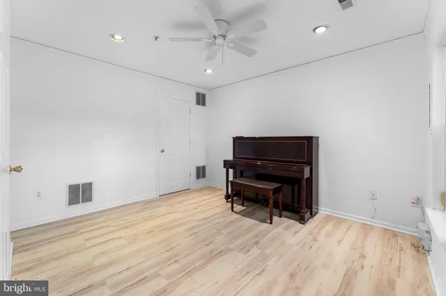 a room with furniture and wooden floor