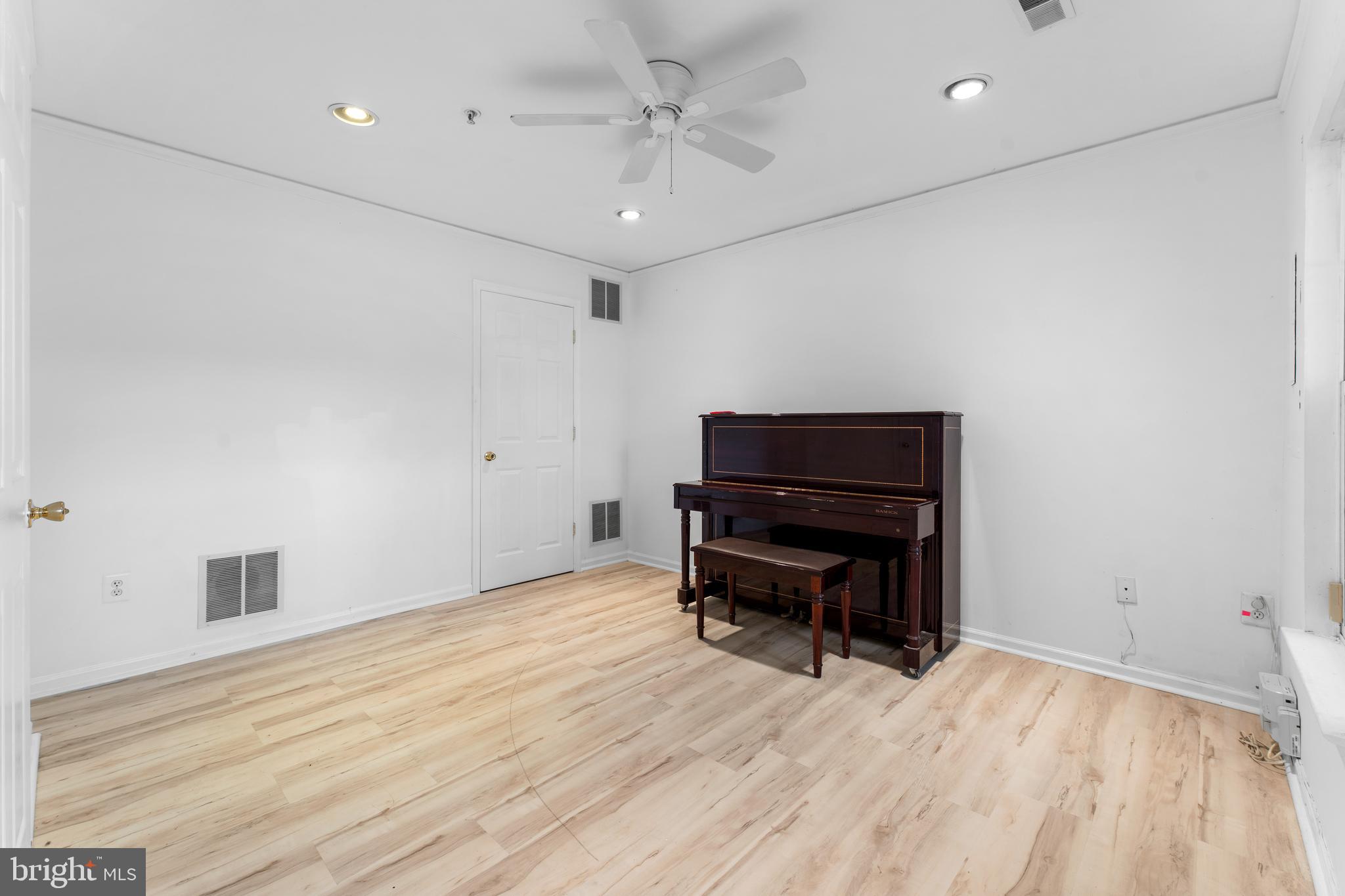 9443 Fields Road Gaithersburg, MD 20878 - Photo 4 of 27 a room with furniture and wooden floor