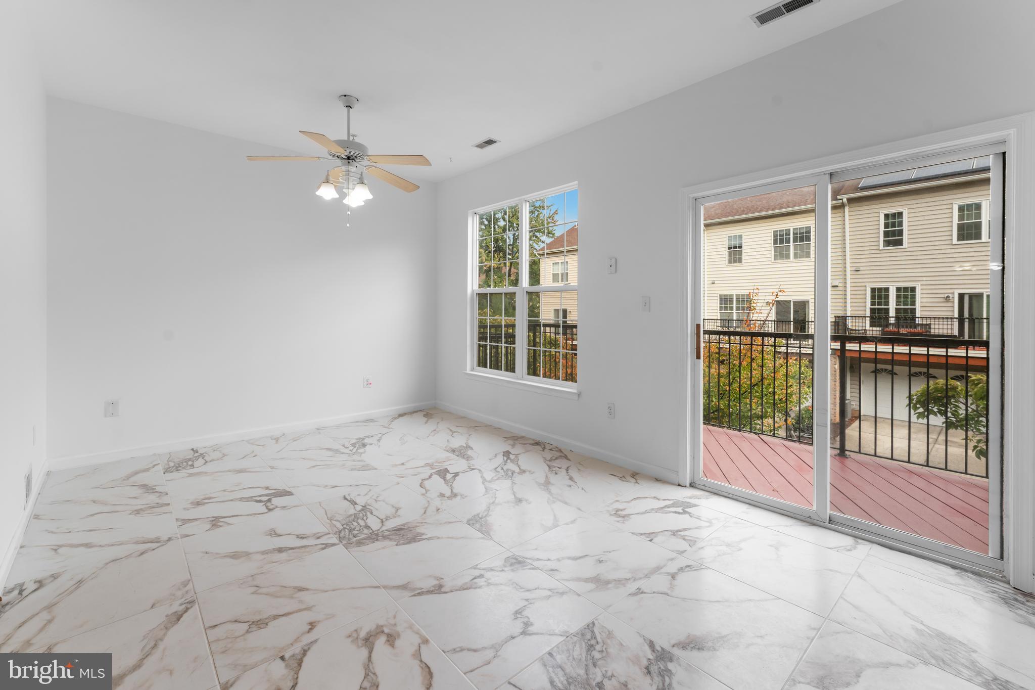 9443 Fields Road Gaithersburg, MD 20878 - Photo 10 of 27 a view of an empty room with a window