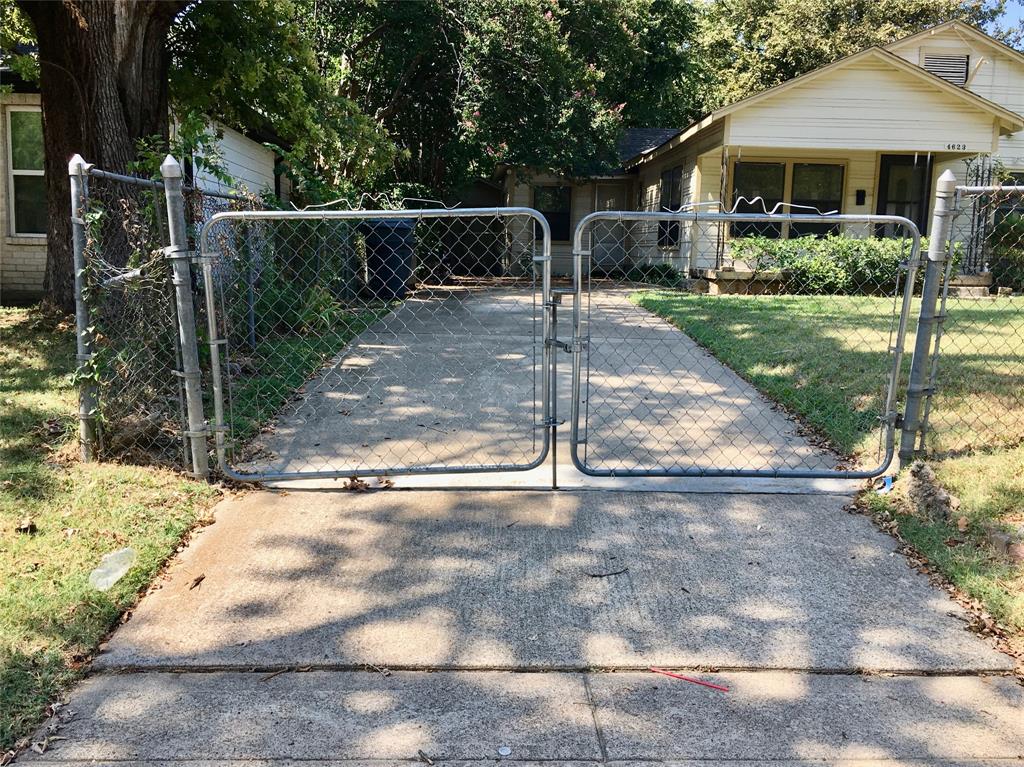 4623 Spring Garden Street Dallas, TX 75215 - Photo 12 of 12 a backyard of a house with fountain table and chairs
