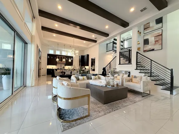 a living room with fireplace furniture and a painting on the wall