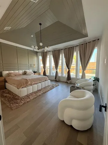 a bedroom with bed and window