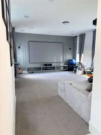 a view of living room with a sink and mirror