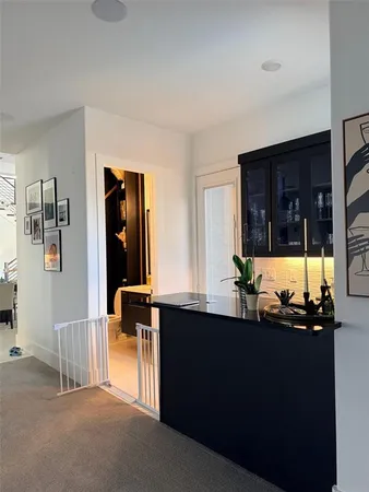 a kitchen with stainless steel appliances a sink and a large window