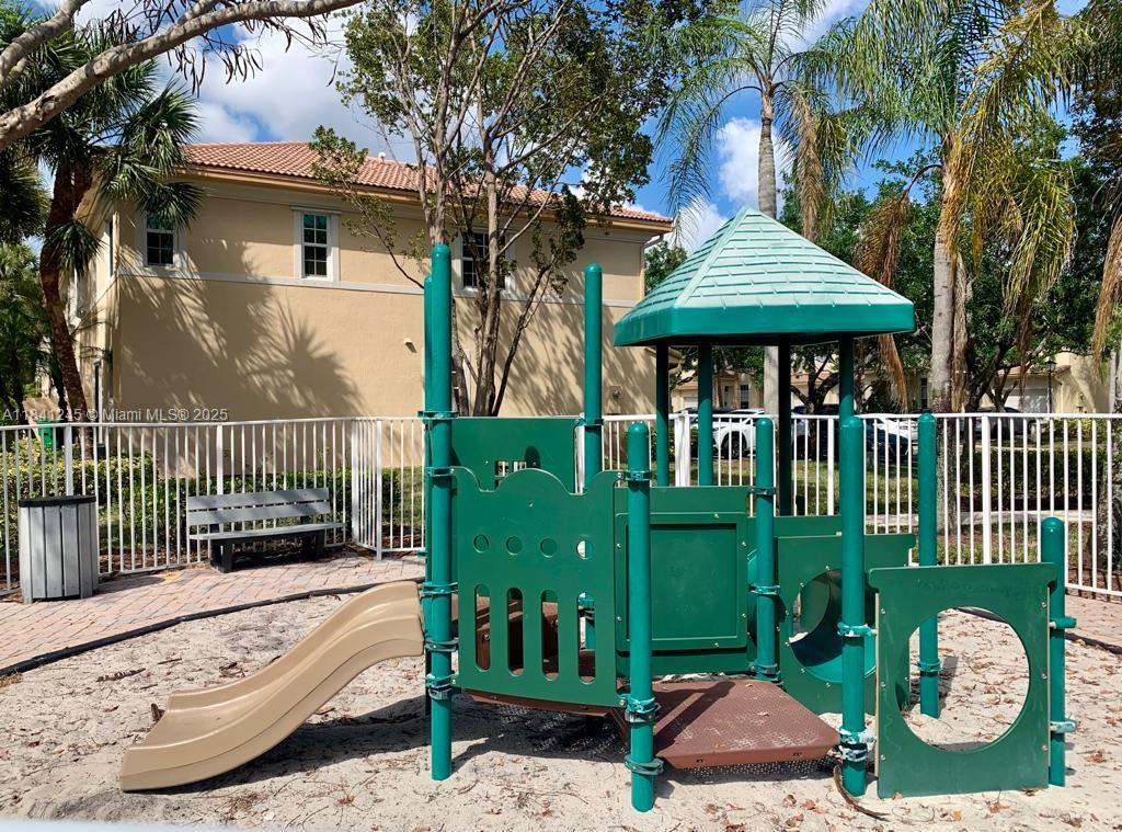 8491 Southwest 27th Street, Unit 101 Miramar, FL 33025 - Photo 10 of 10 a view of a house with a garden