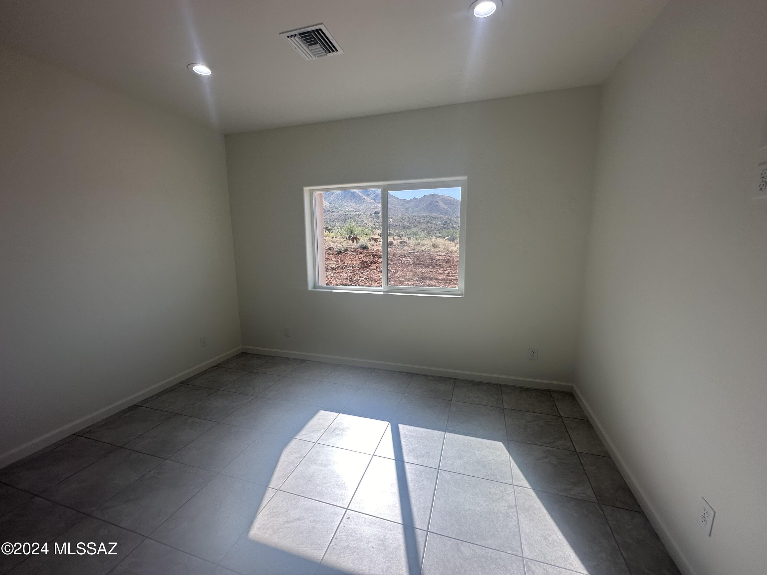 169 Camino Mar Rio Rico, AZ 85648 - Photo 23 of 40 an empty room with a empty space and windows