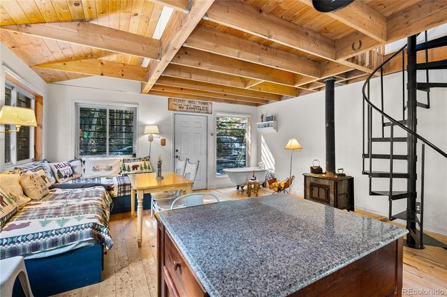 a living room with blue lights with furniture