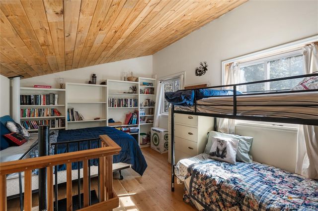 a bedroom with furniture and a window