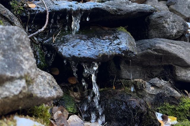 a view of a bench in front of house