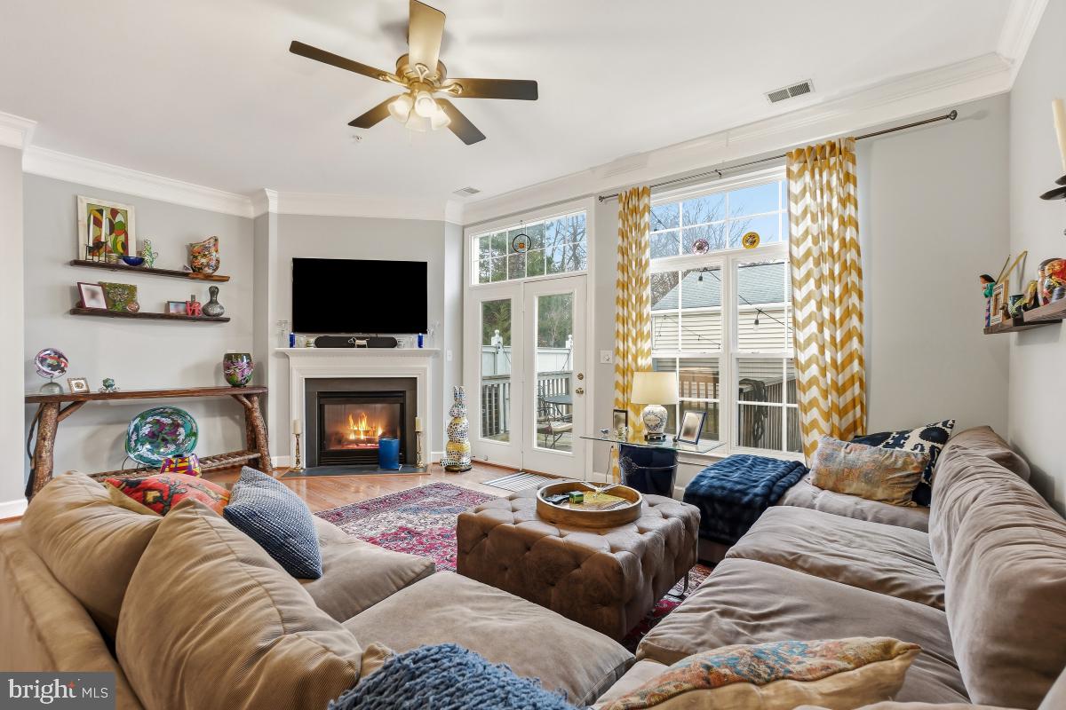 23416 Clarksridge Road Clarksburg, MD 20871 - Photo 15 of 48 a living room with furniture a fireplace and a flat screen tv