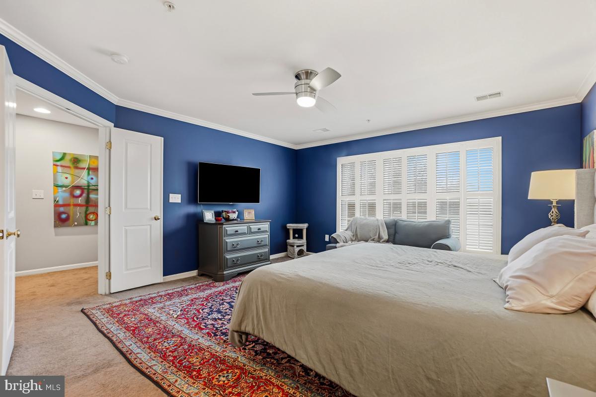 23416 Clarksridge Road Clarksburg, MD 20871 - Photo 24 of 48 a bedroom with a bed and a flat screen tv
