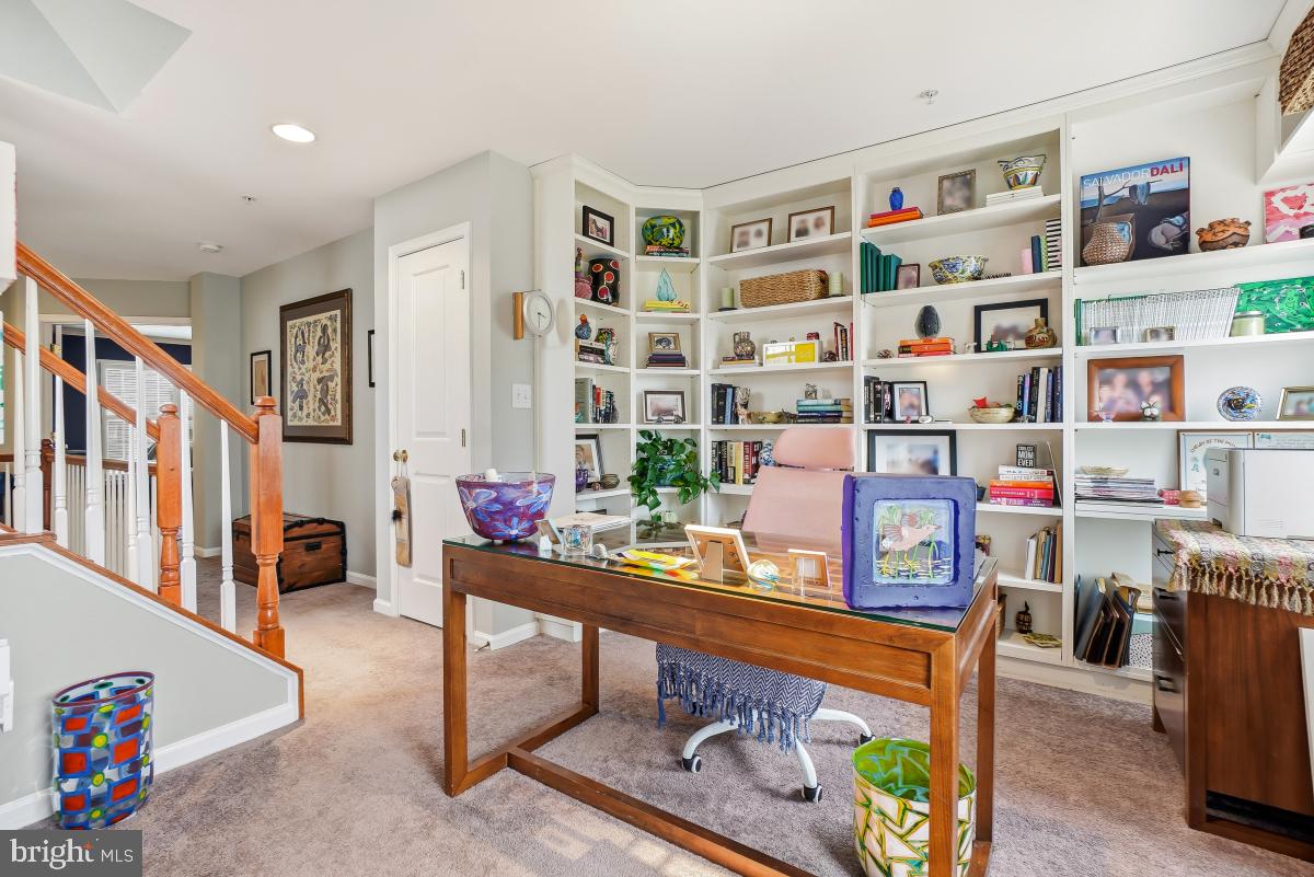 23416 Clarksridge Road Clarksburg, MD 20871 - Photo 29 of 48 a living room with furniture and a book shelf