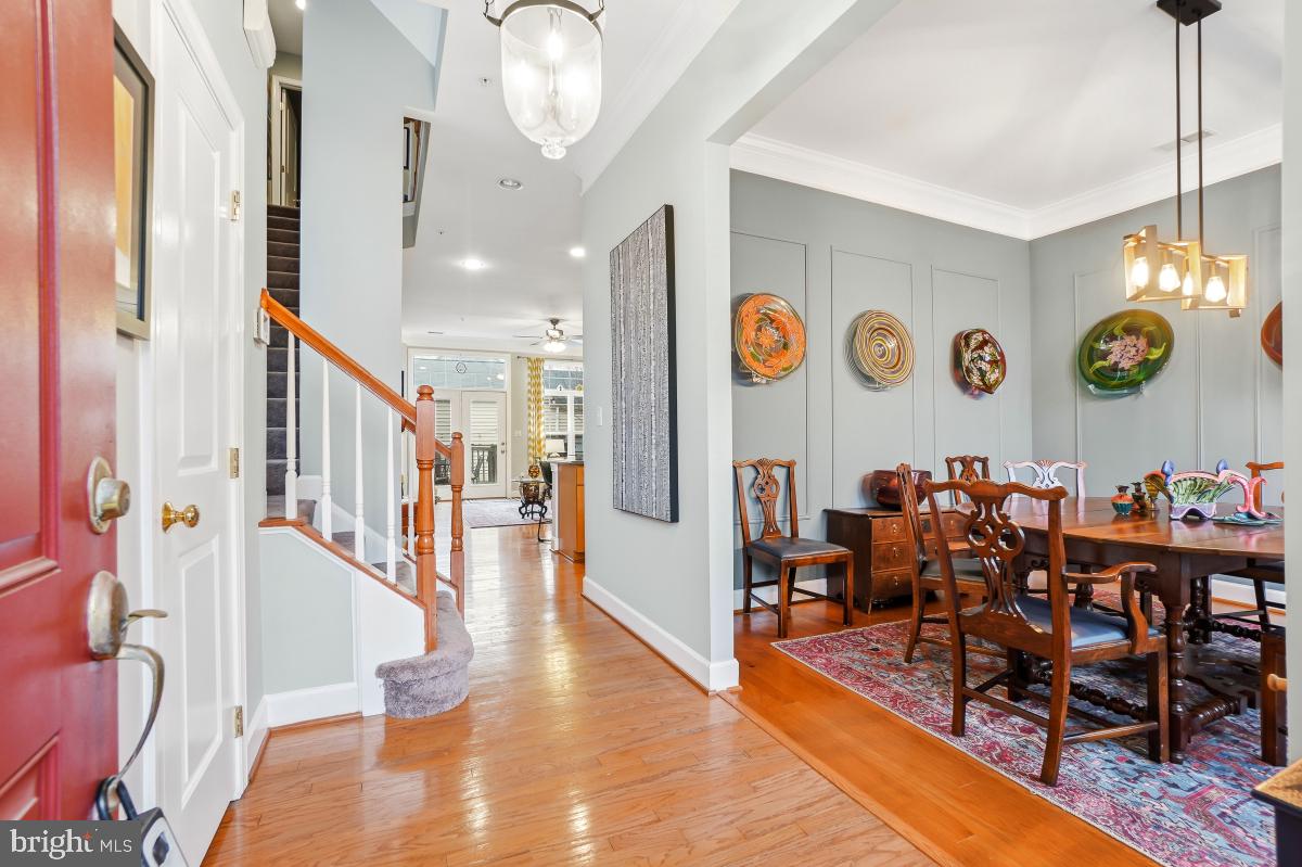 23416 Clarksridge Road Clarksburg, MD 20871 - Photo 3 of 48 a view of a hallway with wooden floor and furniture