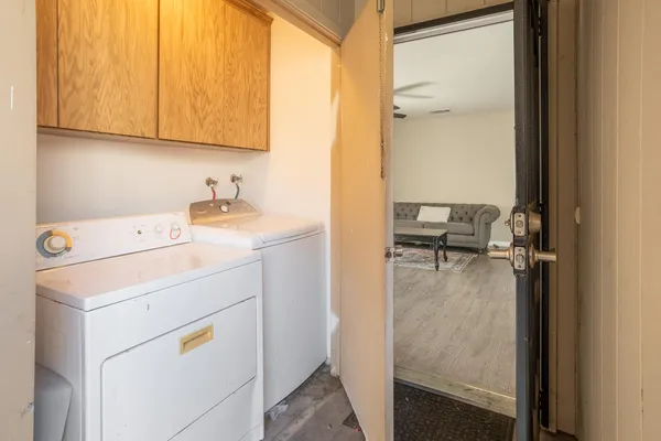 a utility room with dryer and washer