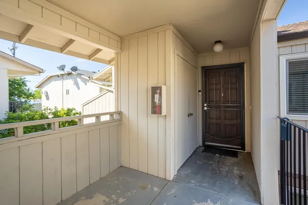 a view of entryway with wooden floor and stairs