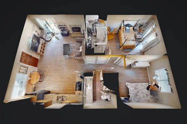 an aerial view of a house with swimming pool and sitting space