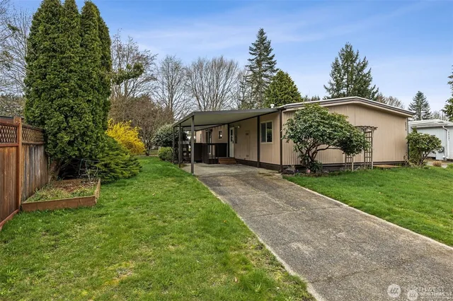 a view of a yard with a house and garden