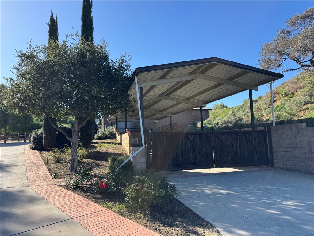 38831 Pauba Road Temecula, CA 92592 - Photo 6 of 30 a view of backyard with table and chairs and potted plants