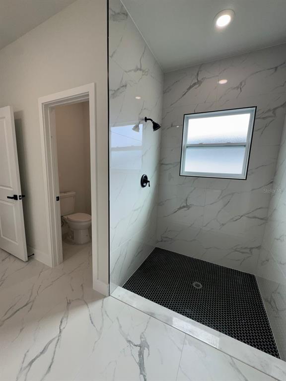 13385 Southwest 32nd Court Ocala, FL 34473 - Photo 9 of 20 a bathroom with a sink and toilet