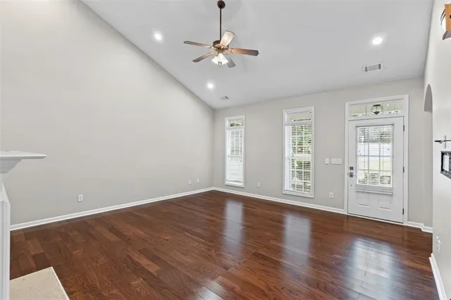 a large kitchen with a stove and a fireplace