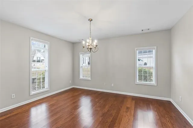 a spacious bedroom with a bed and window