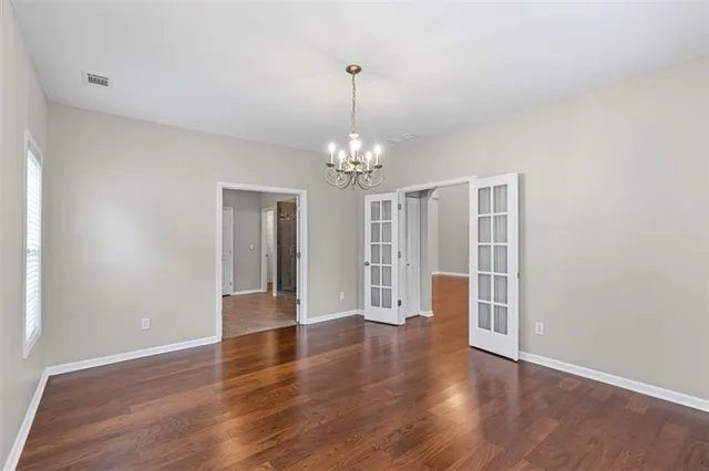 a spacious bathroom with a granite countertop sink a mirror a shower and a bathtub