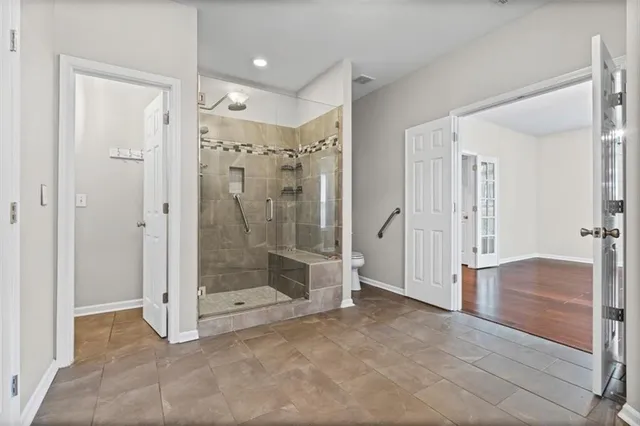 a bathroom with a shower and toilet