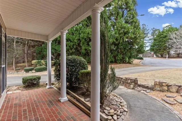a view of a patio with wooden floor