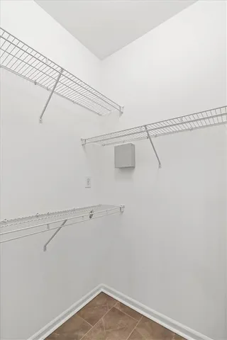 a view of a porch with a ceiling fan and wooden floor