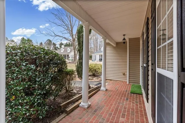 a view of a balcony with wooden floor