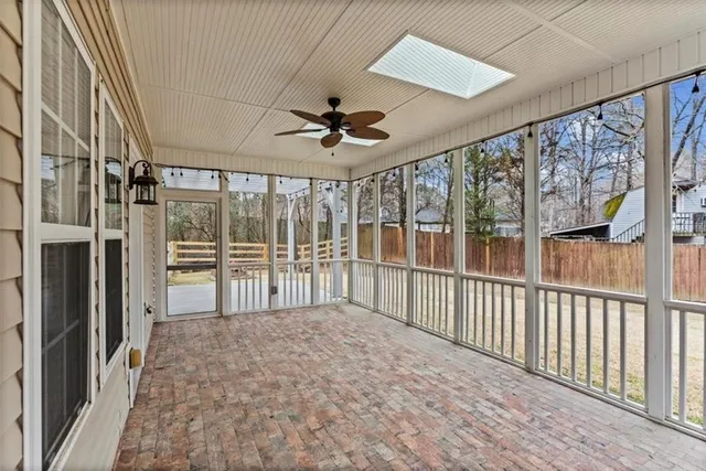a dining room with furniture window and outside view