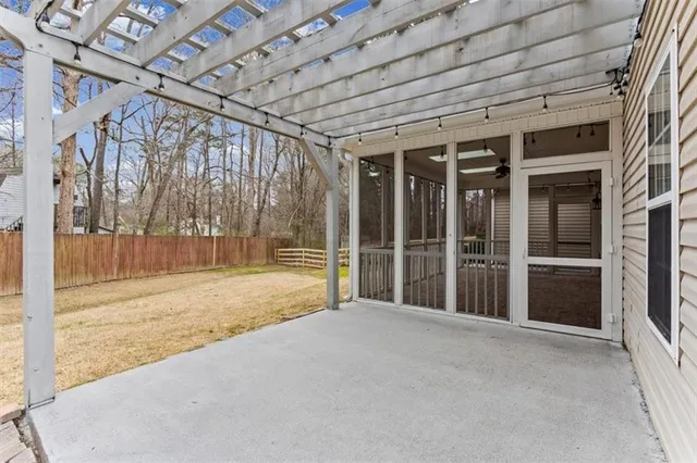 a swimming pool with outdoor seating and yard