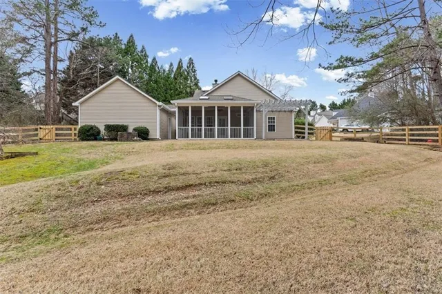 an aerial view of a house with outdoor space