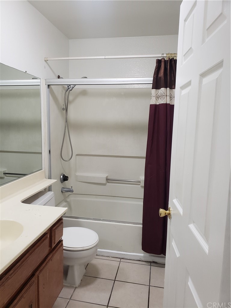 7221 Petrol Street, Unit 6 Paramount, CA 90723 - Photo 15 of 21 a bathroom with a granite countertop sink toilet and shower