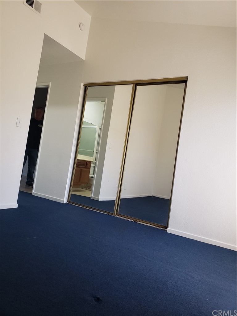 7221 Petrol Street, Unit 6 Paramount, CA 90723 - Photo 17 of 21 a view of an empty room with a mirror