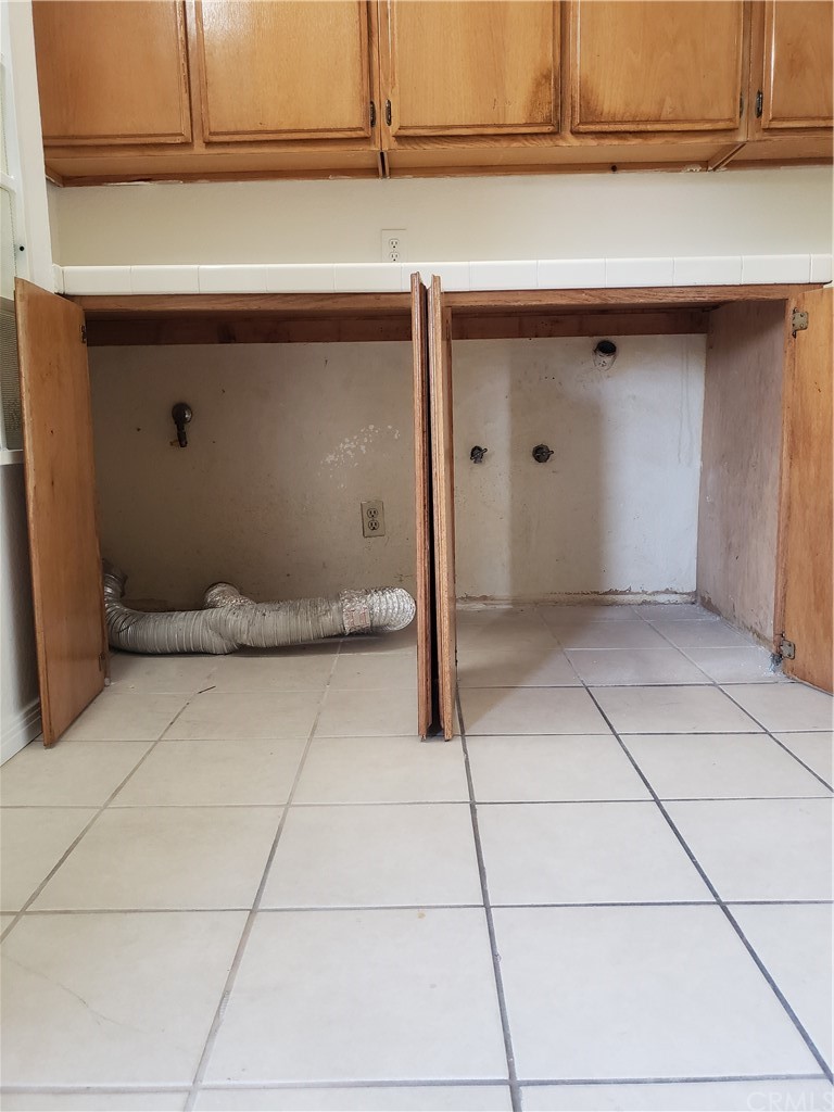 7221 Petrol Street, Unit 6 Paramount, CA 90723 - Photo 19 of 21 a bathroom with a sink and cabinets