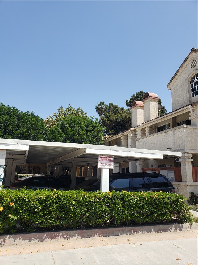 7221 Petrol Street, Unit 6 Paramount, CA 90723 - Photo 21 of 21 a view of a street with a bench in front of it