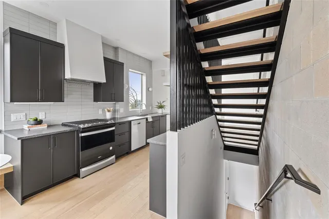 a kitchen with a cabinets and appliances