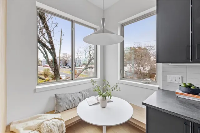 a dining room with furniture and window