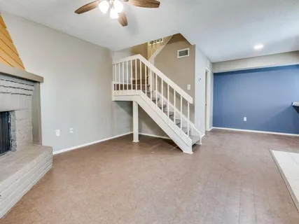 a view of a livingroom with a staircase