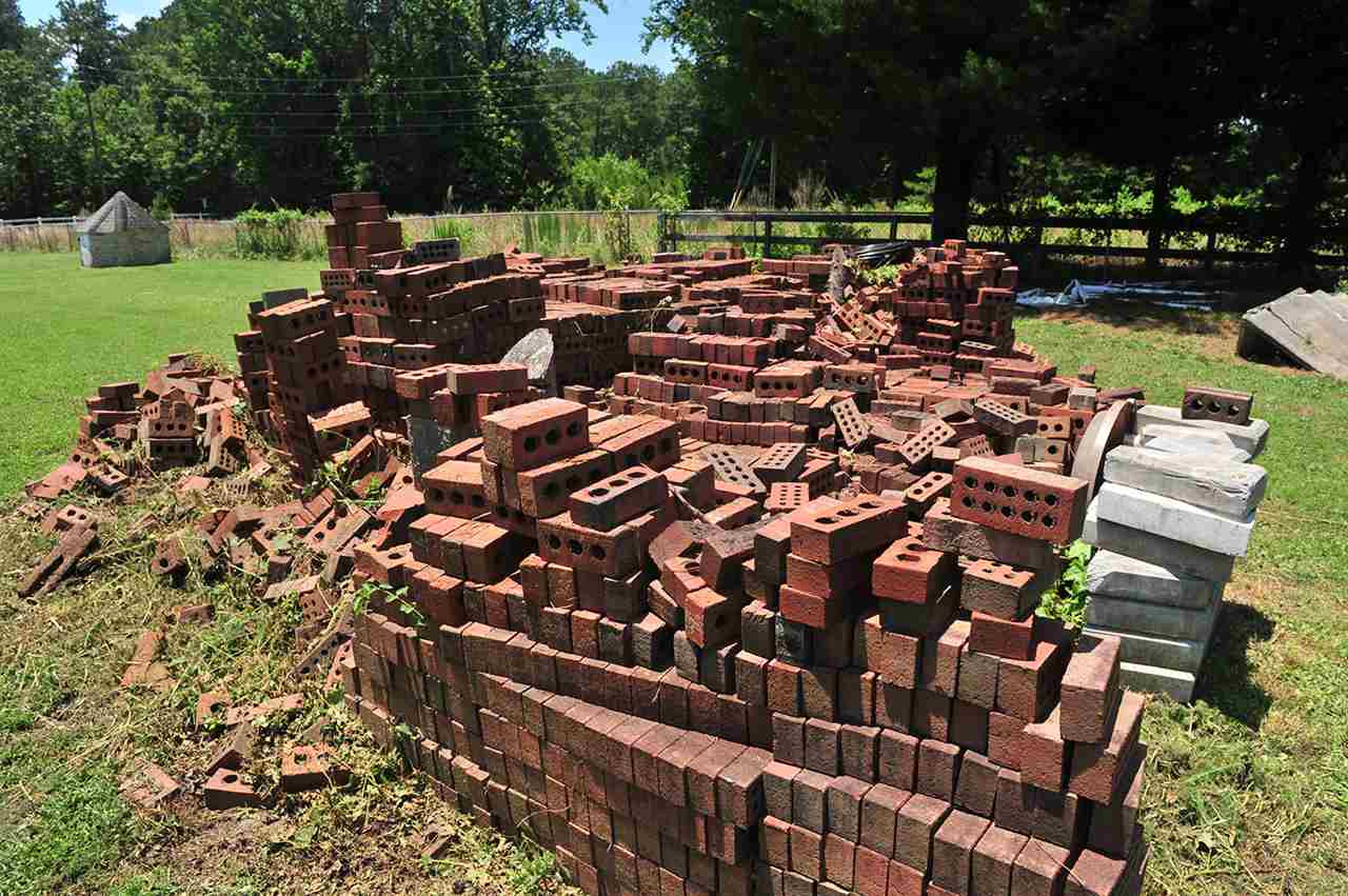 6909 Riley Hill Road Wendell, NC 27591 - Photo 7 of 12 The brick material that is included. The well in upper left of picture is dug and ready for new owner to run plumbing. Permit for septic is initiated and ready for new owner to install. Exterior Back