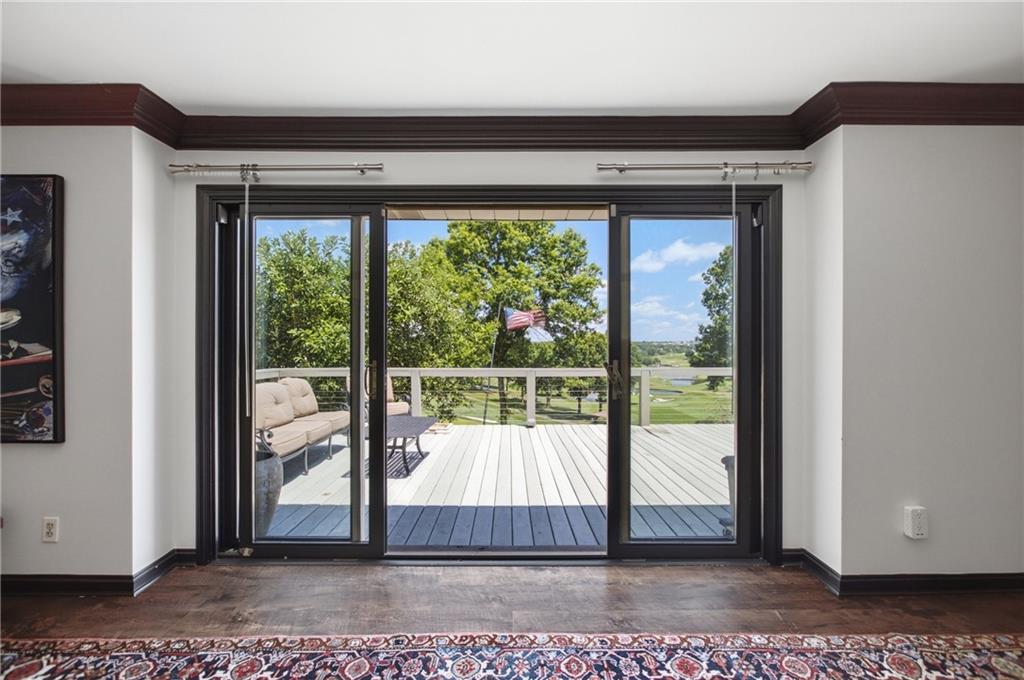 1663 Hastings Mill Road Upper St. Clair, PA 15241 - Photo 19 of 37 Double doors lead to the expansive outdoor deck, creating a seamless transition to outdoor living.