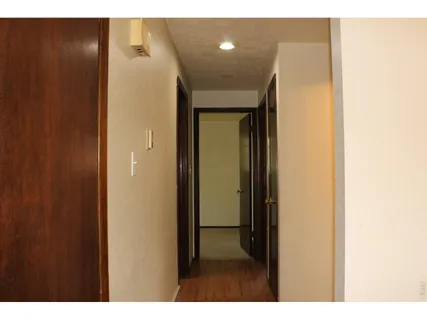 a view of a elevator and an empty room