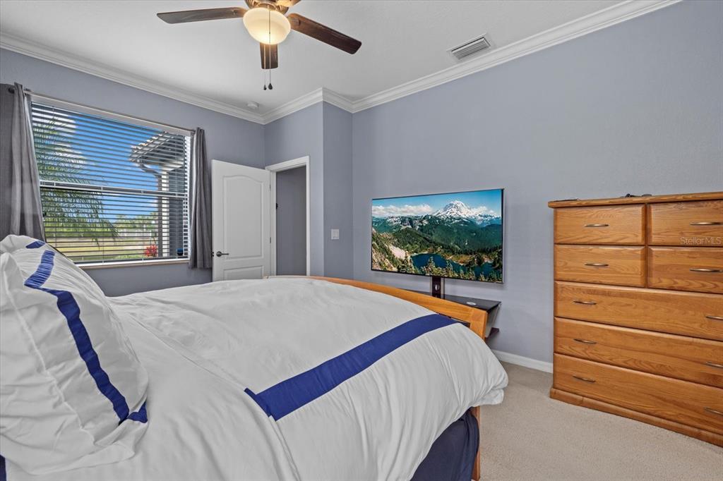 17018 Blue Rdg Place Bradenton, FL 34211 - Photo 17 of 34 a bedroom with a bed and a window