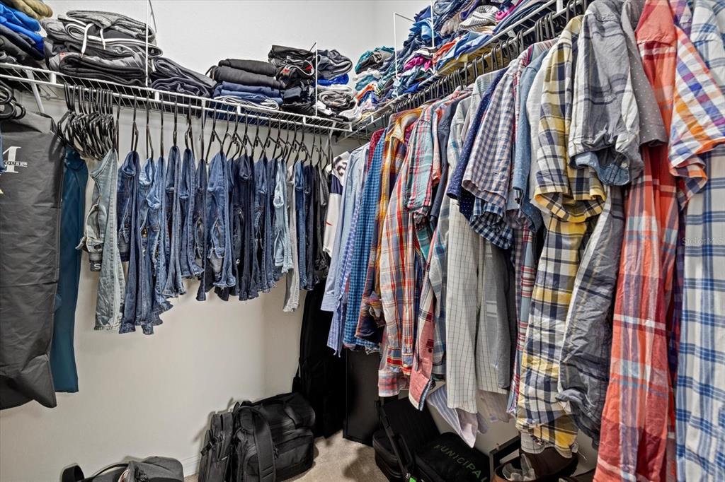 17018 Blue Rdg Place Bradenton, FL 34211 - Photo 18 of 34 a view of walk in closet with clothes and shoes