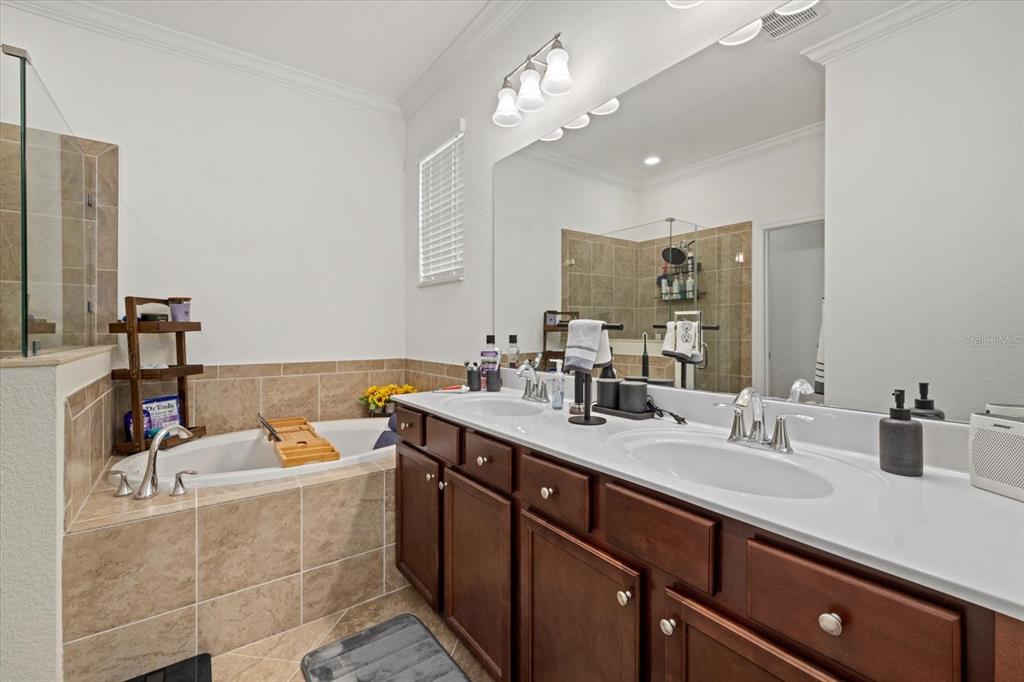 17018 Blue Rdg Place Bradenton, FL 34211 - Photo 19 of 34 a bathroom with a sink double vanity granite and a mirror
